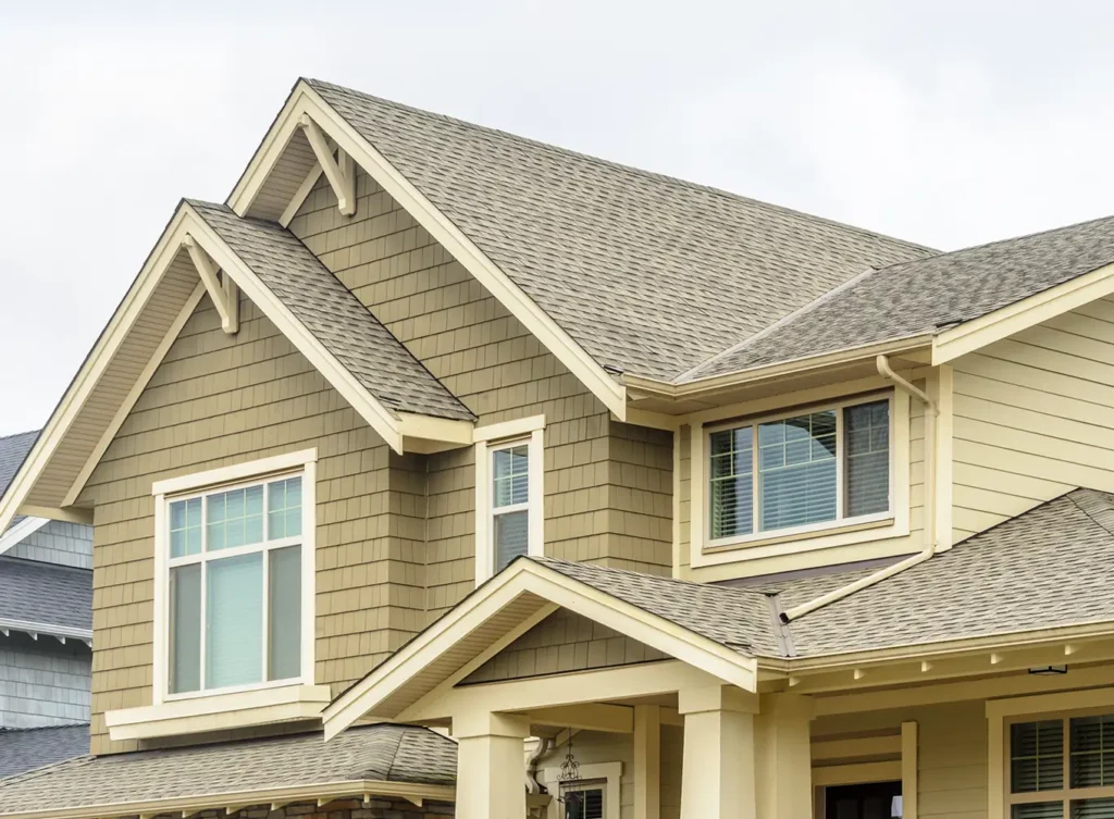 modern home with yellow siding and asphalt roofing shingles central illinois