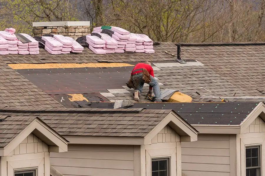 A townhouse roof in Taylorville, IL, after the removal of the old shingles, making it ready for reroofing.