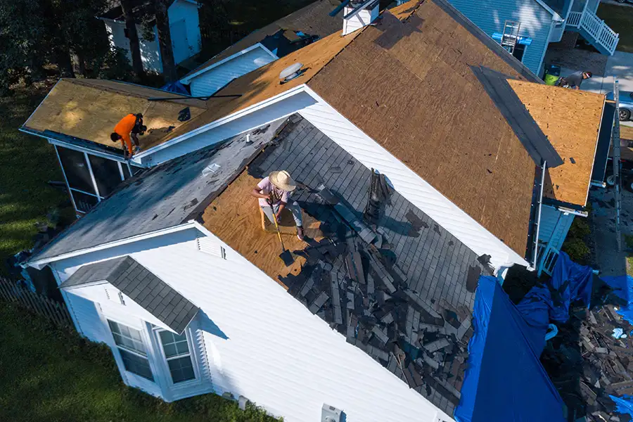 Workers perform a residential roof replacement for a homeowner in Pana, IL.