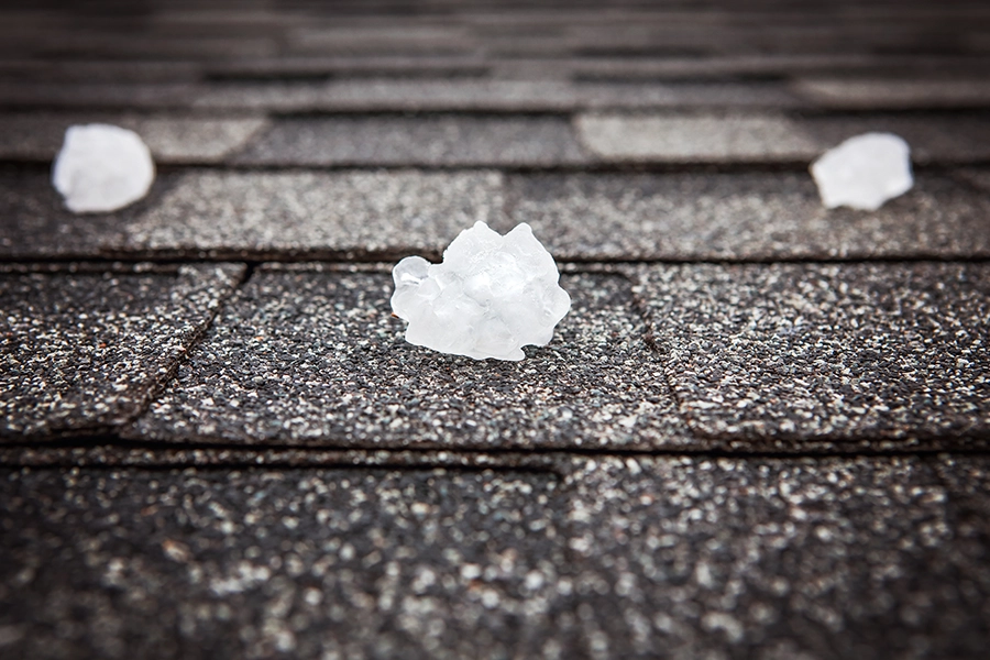 Pieces of hail on a rooftop in Taylorville, IL, after a hailstorm.