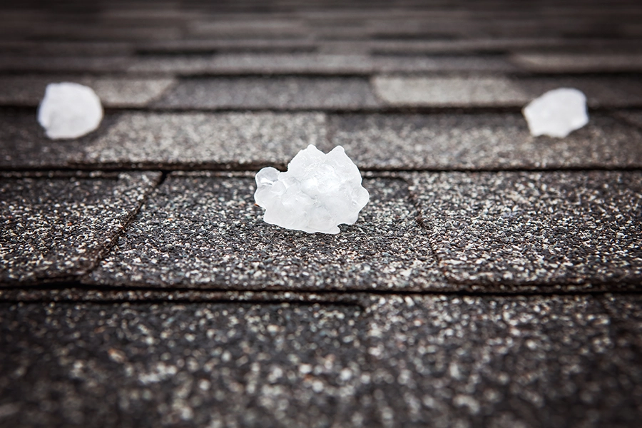 Several pieces of hail on a roof in Pana, IL, after a storm.