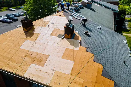 At Your Service Roofing—Professional roofers install a new roof to a residence in Springfield, IL.
