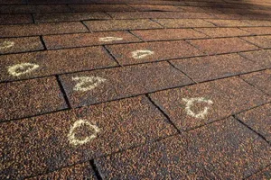 At Your Service Roofing—A residential roof in Pana, IL, with hail damage and inspection markings.