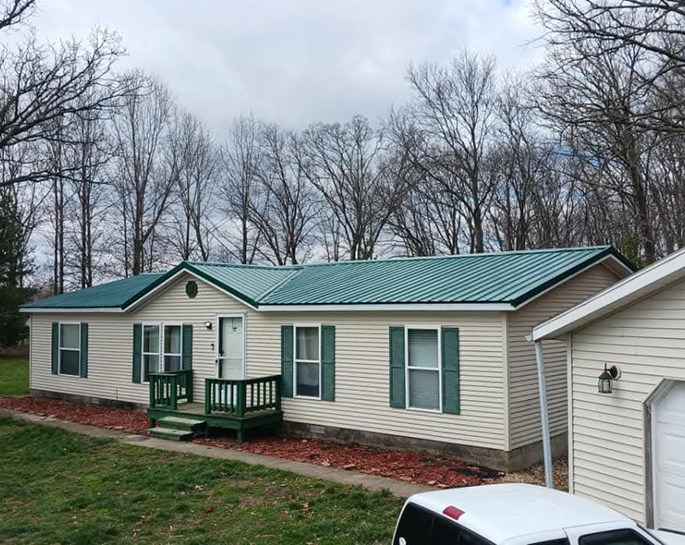 residential home with metal roofing installed in central il