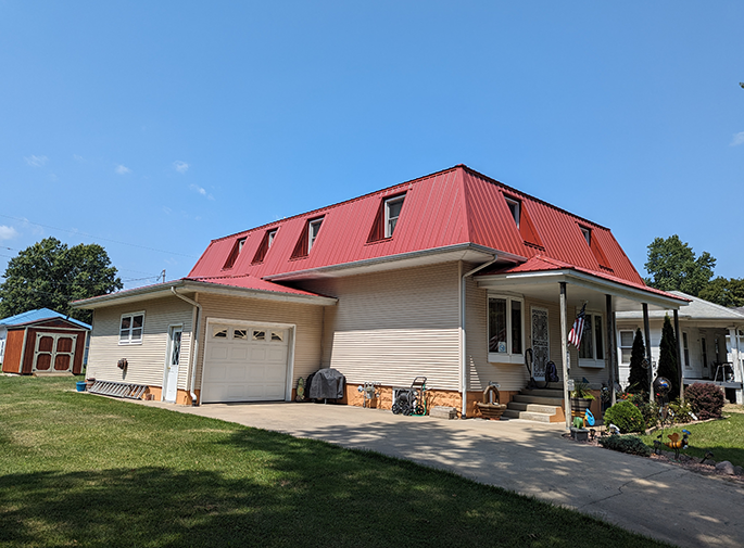 home with vinyl siding and a metal roof central illinois